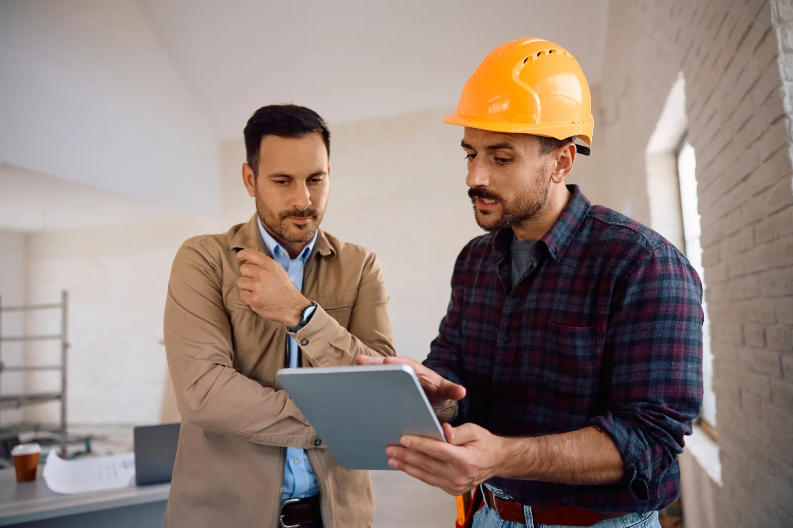 Contractor and homeowner reviewing a plan together