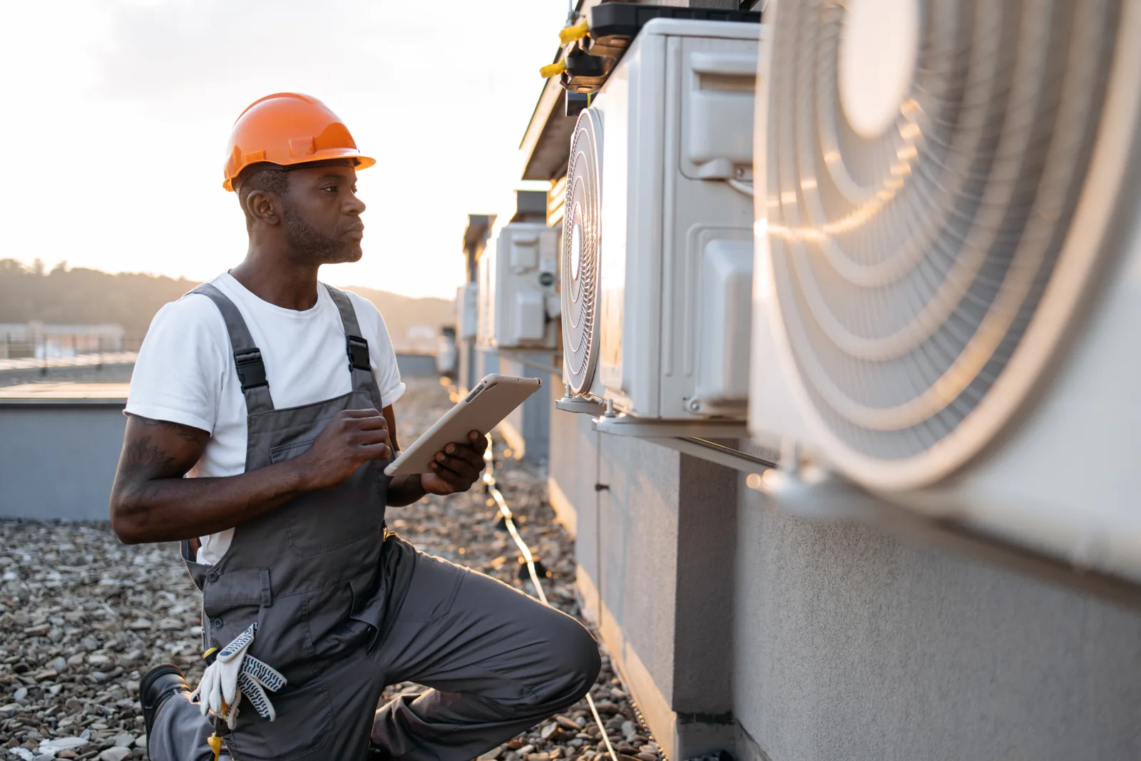 Technician checking HVAC service information on a tablet