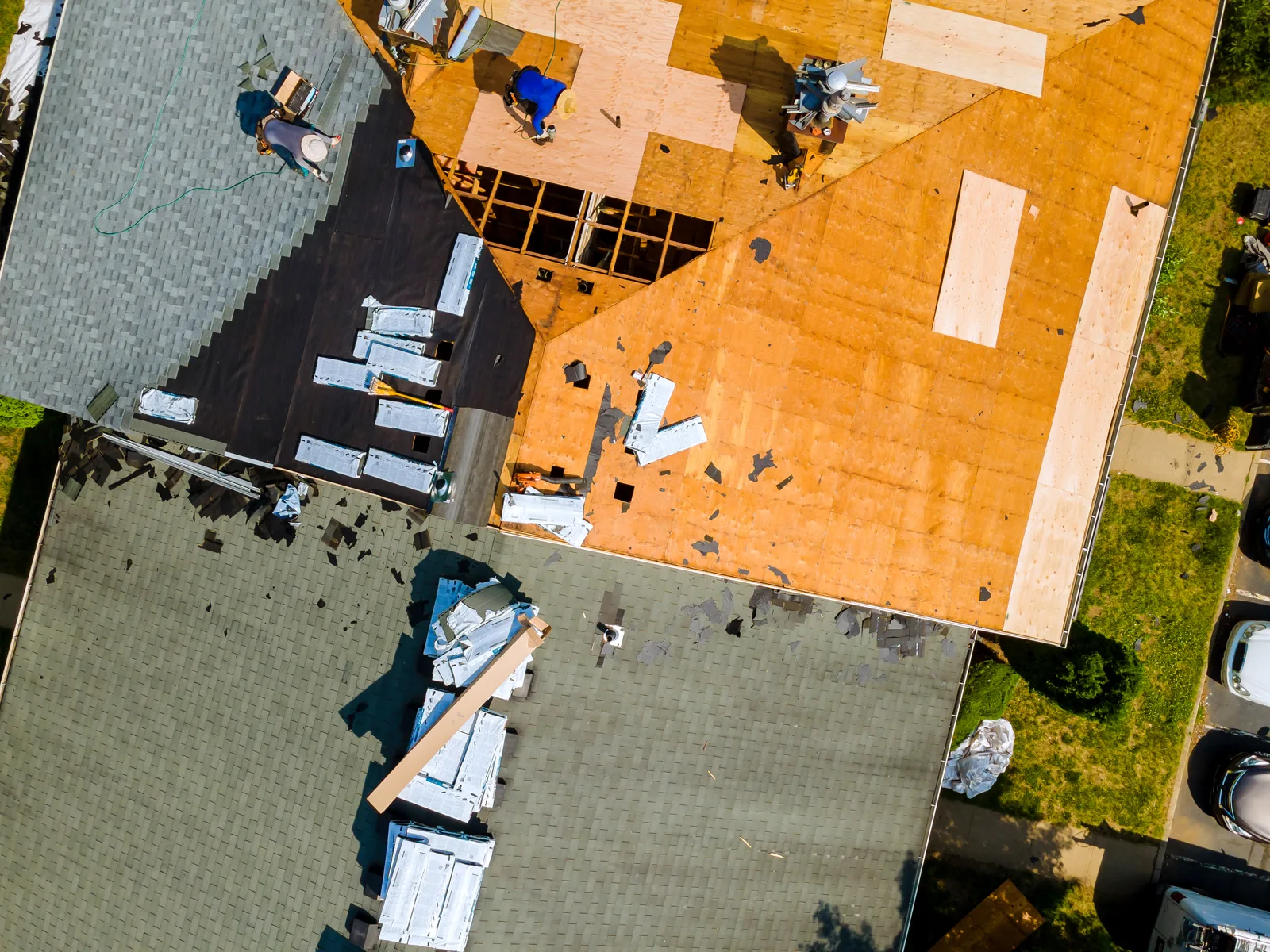 Roofing work in progress on a house